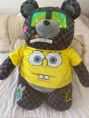 Sprayground Freddy Bear Backpack – Black & Gray Checkered, Yellow Graphic Design
